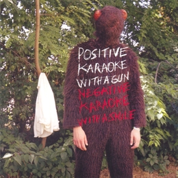 Image du média "POSITIVE KARAOKE WITH A GUN NEGATIVE KARAOKE WITH A SMILE de EXPERIENCE"